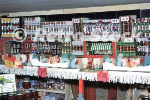 British grocery shop Christmas 1950s vintage photo showing shop window display with Christmas crackers and festive grocery items