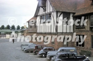 Guildhall in Sandwich, Kent with medieval timber-framed façade and parked 1950s cars, 1956