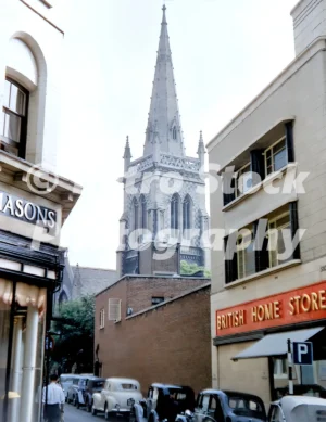 Tower Street in Ipswich with parked cars and church spire, 1956