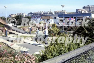 Crazy golf course on Tower Road in Newquay with families playing, 1970s