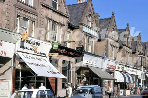 A 1971 street view of Northdown Road in Cliftonville featuring Leonards Interflora Florists and the Cliftonville Post Office housed in ornate Victorian buildings.