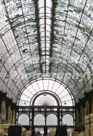 A 1950s colour photo of the interior of the Floral Hall in Covent Garden, London, showing the glass and iron roof.