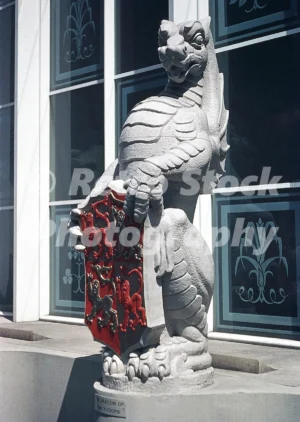 A 1950s colour photo of "The Red Dragon of Wales" (labeled as The Dragon of the Tudors), one of James Woodford’s "The Queen's Beasts" sculptures, on display at Westminster Abbey for the 1953 Coronation.