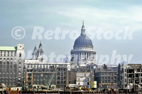 St Paul’s Cathedral rising above Thames riverside redevelopment and cranes, London 1969