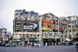 A 1960s colour photo of the London Pavilion at Piccadilly Circus featuring a large film poster for The Hoodlum Priest in 1961.