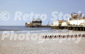 1960s view of the Steel Pier in Atlantic City with a crane carrying out repairs