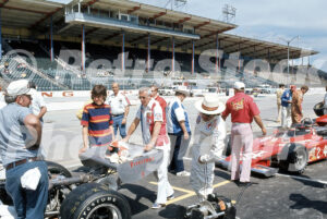 1970s USAC Champ Car grid scene at Wisconsin State Fair Speedway with driver Mike Mosley