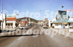 1970s Route 66 street scene in Williams, Arizona with roadside motels