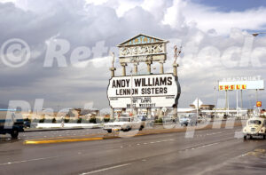 A 1970s color photo of the Caesars Palace marquee advertising Andy Williams and the Lennon Sisters on the Las Vegas Strip in 1972.