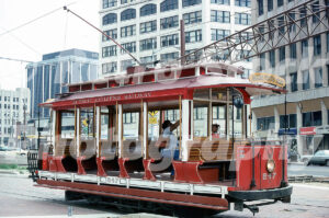 A 1970s color photo of the red open-air car no. 247 of the Detroit Citizens Railway at the Grand Circus Park terminal in 1978.