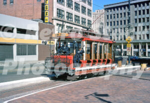 A 1970s colour photo of the red open-air vintage car no. 247 of the Detroit Citizens Railway on Washington Boulevard in 1978.