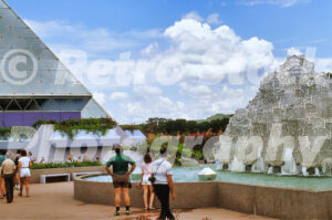 A 1980s color photo of the Journey Into Imagination pavilion at Epcot Center in Florida, featuring the glass pyramid architecture and the leaping "pop-jet" water fountains.