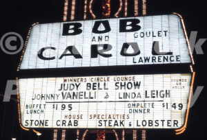 A 1970s colour photo of the glowing white Frontier Casino marquee at night in Las Vegas in 1970s.