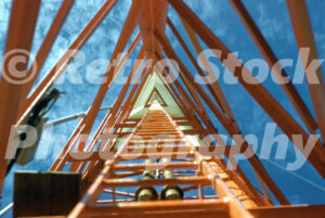 A 1950s color photo looking straight up through the interior of the orange steel lattice of the new WJRT Channel 12 antenna tower in Flint, Michigan.