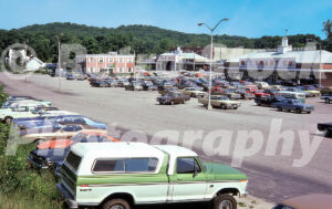 A 1970s color photo of the W.T. Grant Co. department store and Cinema at North Street Shopping Center in Danbury, Connecticut, with a green and white Ford F-100 Ranger XLT in the foreground.