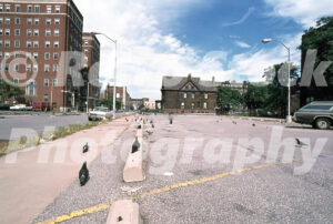 A 1980s color photo of pigeons in a parking lot at the intersection of Cass Avenue and Parsons Street in Detroit, Michigan in 1980.