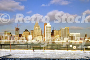 A 1960s color photo of the Detroit skyline and Cobo Arena viewed across the icy Detroit River from Windsor, Ontario in 1963.