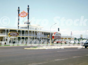 A 1960s color photo of the glowing blue and white neon Showboat Hotel and Casino in Las Vegas in 1969.