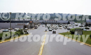 A 1970s color photo of the Triangle Shopping Center in Yorktown Heights, New York, featuring W.T. Grant City, Finast supermarket, and a restaurant coffee shop.