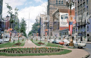 A 1960s color photo of Washington Boulevard looking north from State Street with the Statler Hilton and landscaped gardens in Detroit, Michigan in 1963.