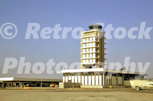 A 1960s color photo of the mid-century modern control tower and terminal at Kent County Airport in Grand Rapids, Michigan, in 1964.