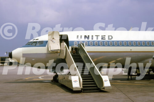 United Airlines Boeing 727-22 with mobile passenger steps at a US airport in the 1960s