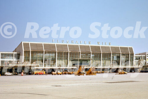 Vienna International Airport terminal building at Flughafen Wien in 1972 with apron and ground equipment