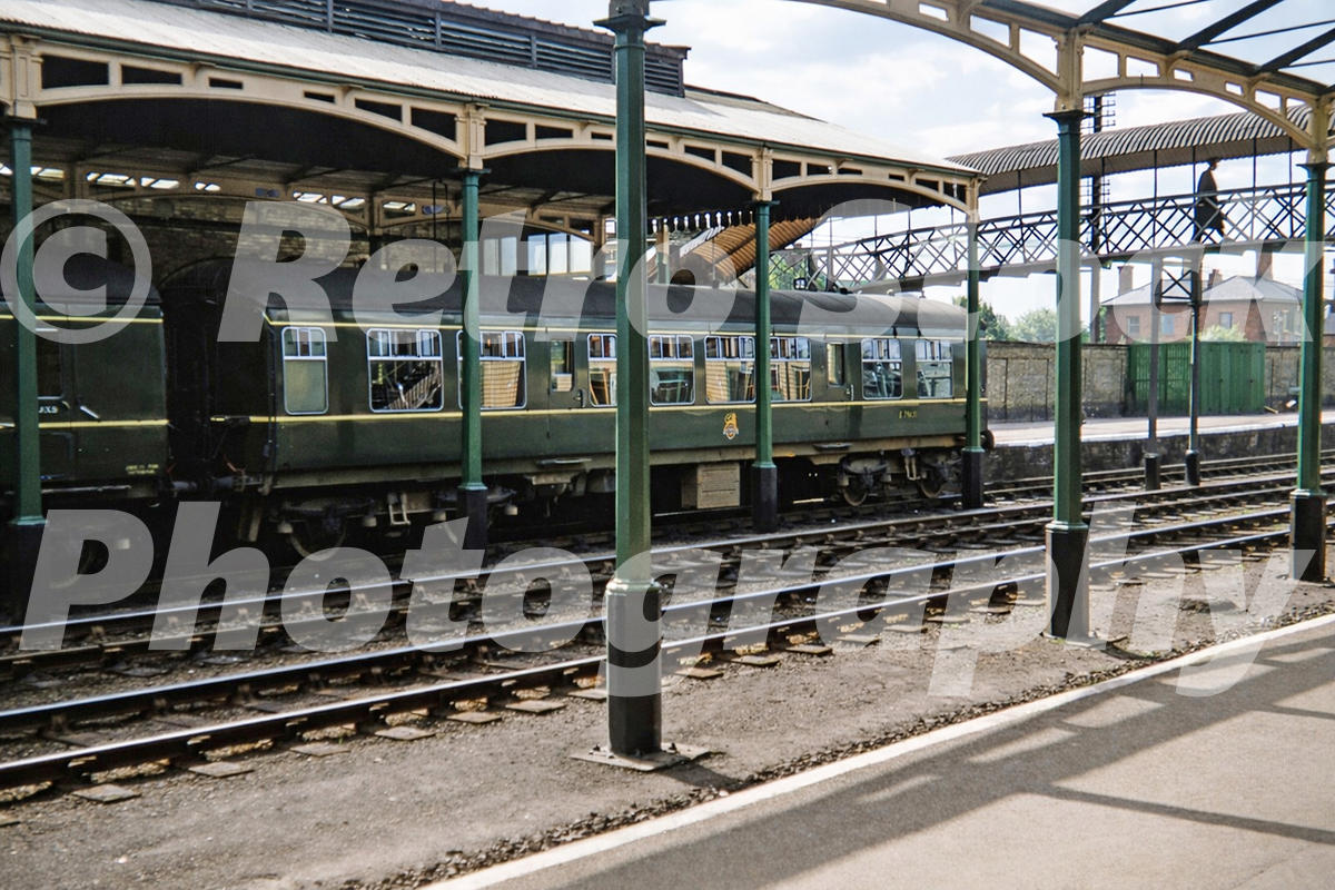1950s view of Boston railway station in Lincolnshire with a DMU in the platform beneath the large station canopies and footbridge