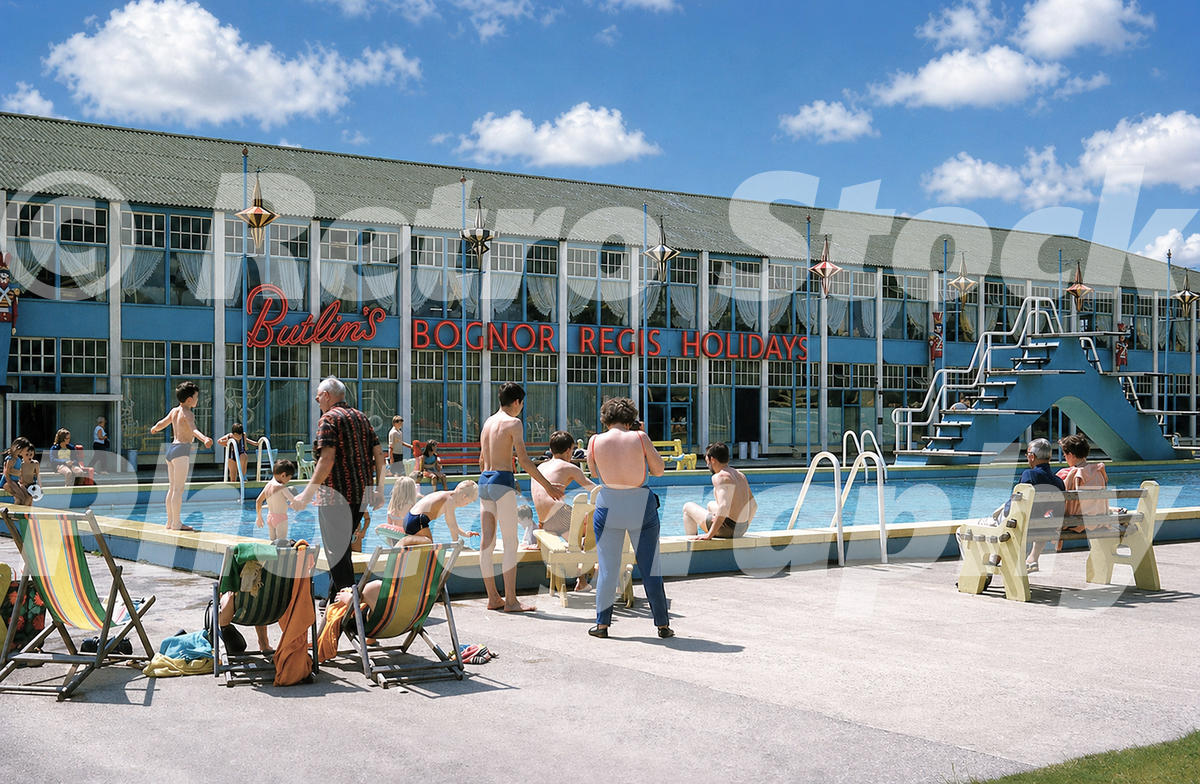 Butlins Bognor Regis outdoor pool in the 1960s with diving platform, deckchairs and Bognor Regis Holidays sign