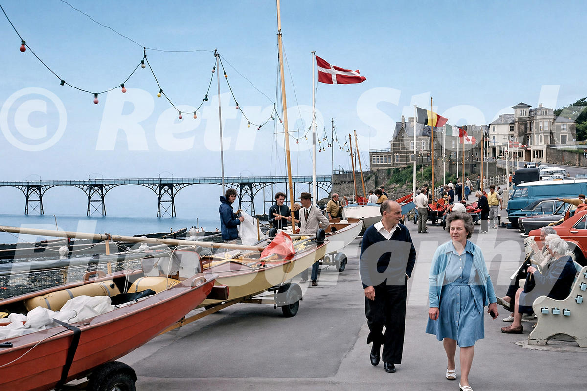 clevedon-somerset-1970s_55232154050_o 1970s view of Clevedon seafront in Somerset with sailing boats, pedestrians, flags and Clevedon Pier.