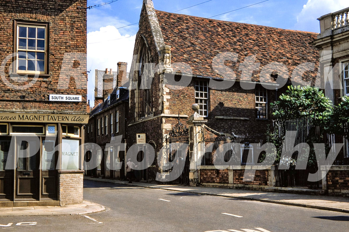 1950s view of Boston Guildhall in Lincolnshire from South Square, with the Magnet Tavern, historic brick buildings and street signs.