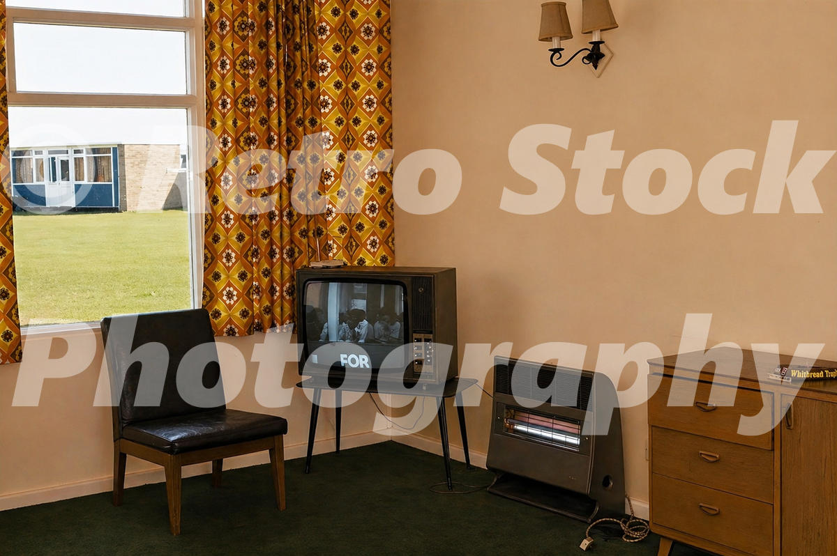 Holimarine Holiday Camp chalet interior at Burnham-on-Sea in the 1970s with black and white television, patterned curtains, electric heater and chest of drawers