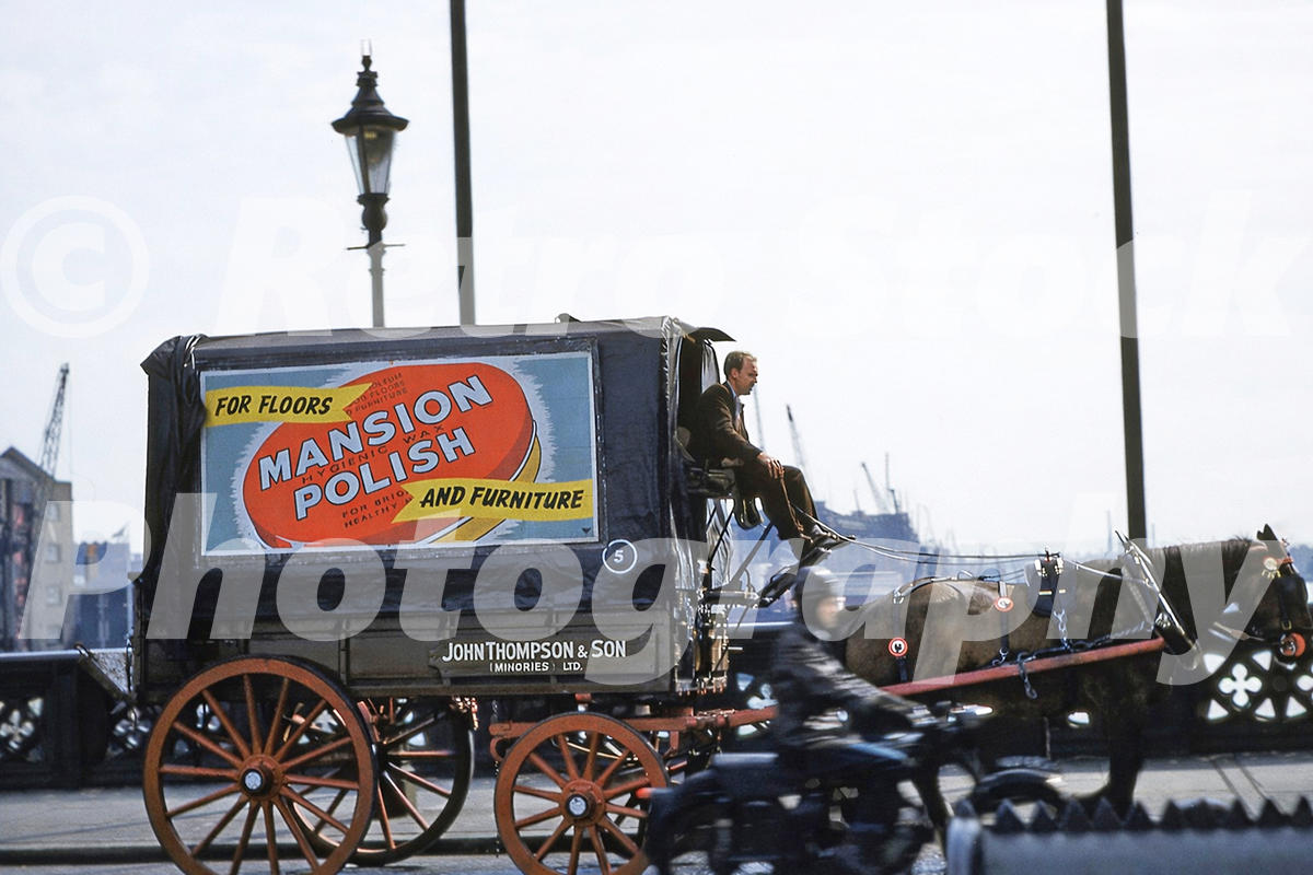 horse--cart-on-tower-bridge-london-1955_55231896038_o A 1950s colour photo of a horse-drawn delivery cart crossing Tower Bridge, featuring a large advertisement for "MANSION POLISH" and a motorcyclist passing by.