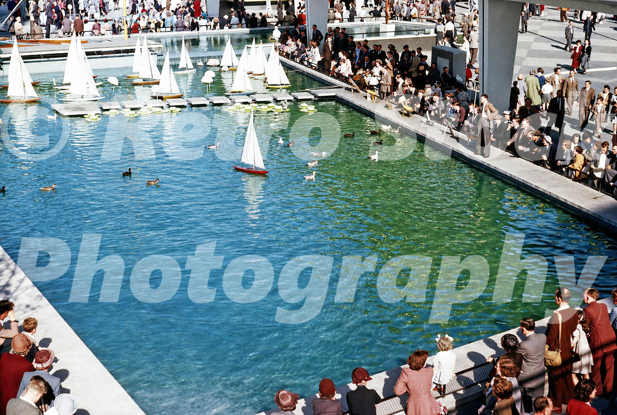 model-boat-pond-festival-of-britain-1951_55239083528_o Vintage 1950s colour photo of the model boat pond at the Festival of Britain on the South Bank in London, with crowds and small sailing boats.