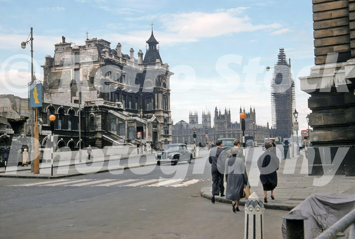 1950s view of Westminster Bridge Road in London, with old St Thomas’s Hospital, Westminster Bridge, Big Ben in scaffolding, taxis and pedestrians.