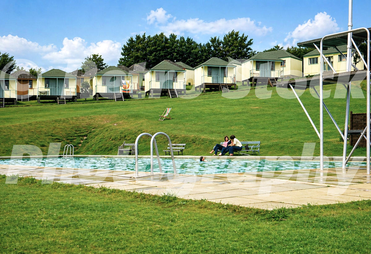 Pontins Dolphin Holiday Camp at Brixham in the 1960s with outdoor pool, diving platform and hillside chalets