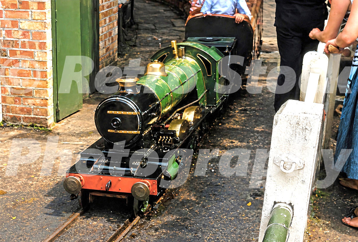1950s view of Prince Edward miniature steam locomotive on the Ruislip Lido Railway with passengers behind.
