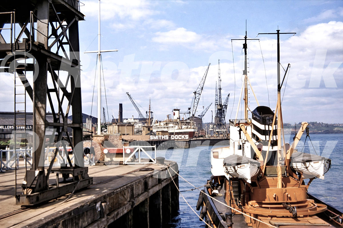 Tyne Commission Quay at North Shields with moored ship and dock cranes in the 1950s