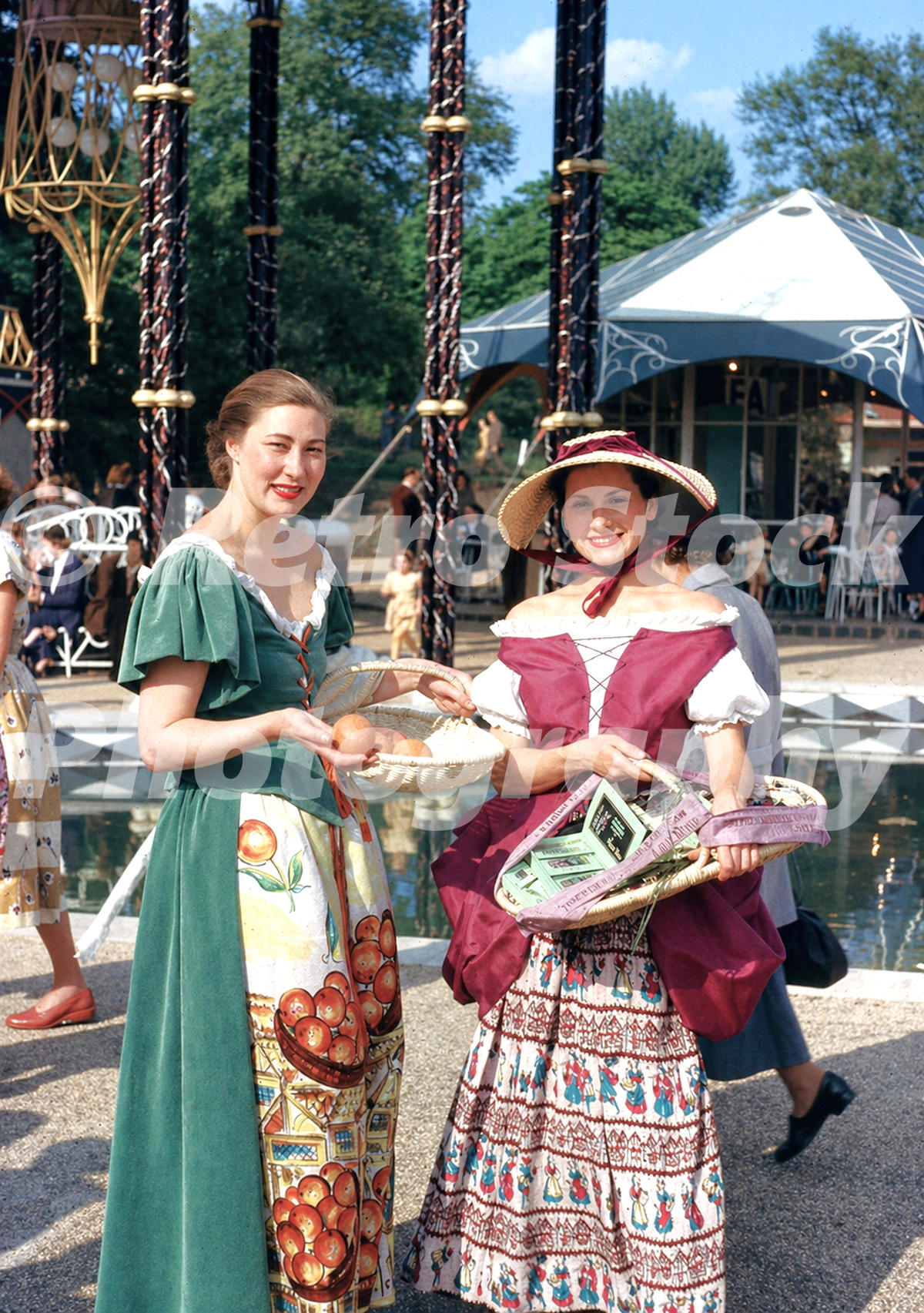 Vintage 1950s colour photo of women selling oranges and lavender sprigs at the Festival Pleasure Gardens in Battersea Park, London.