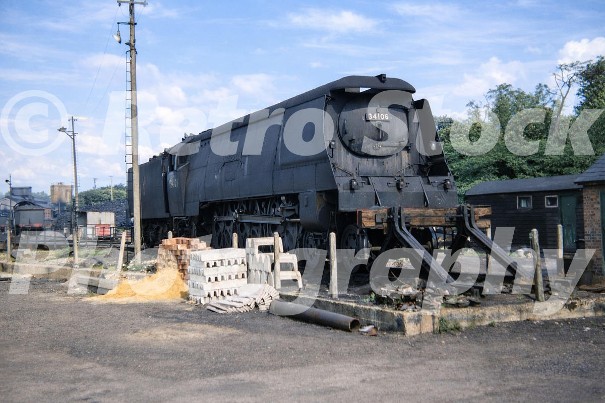 1950s view of West Country Class 34106 Lydford at Bournemouth with the locomotive standing at buffer stops in a railway yard