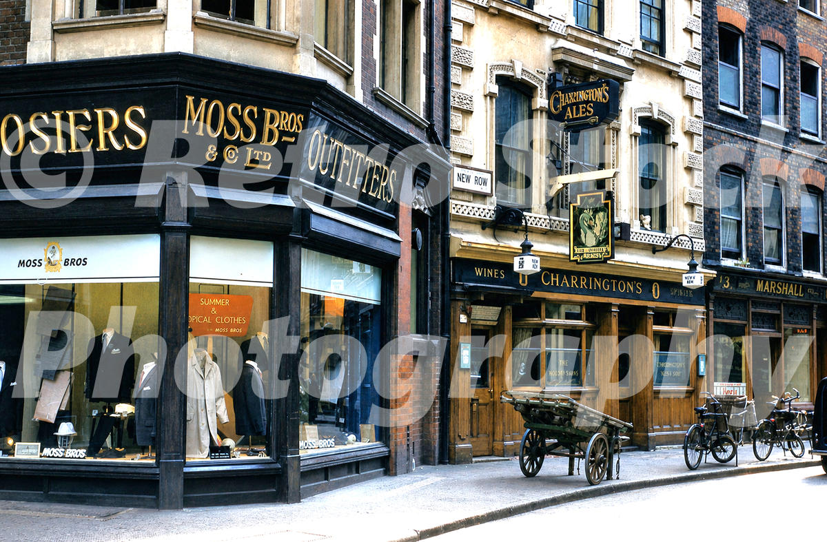 The White Swan pub, New Row, London 1960 A 1960s colour photo of The White Swan pub and Moss Bros outfitters on New Row in 1960 with a wooden handcart in the street.