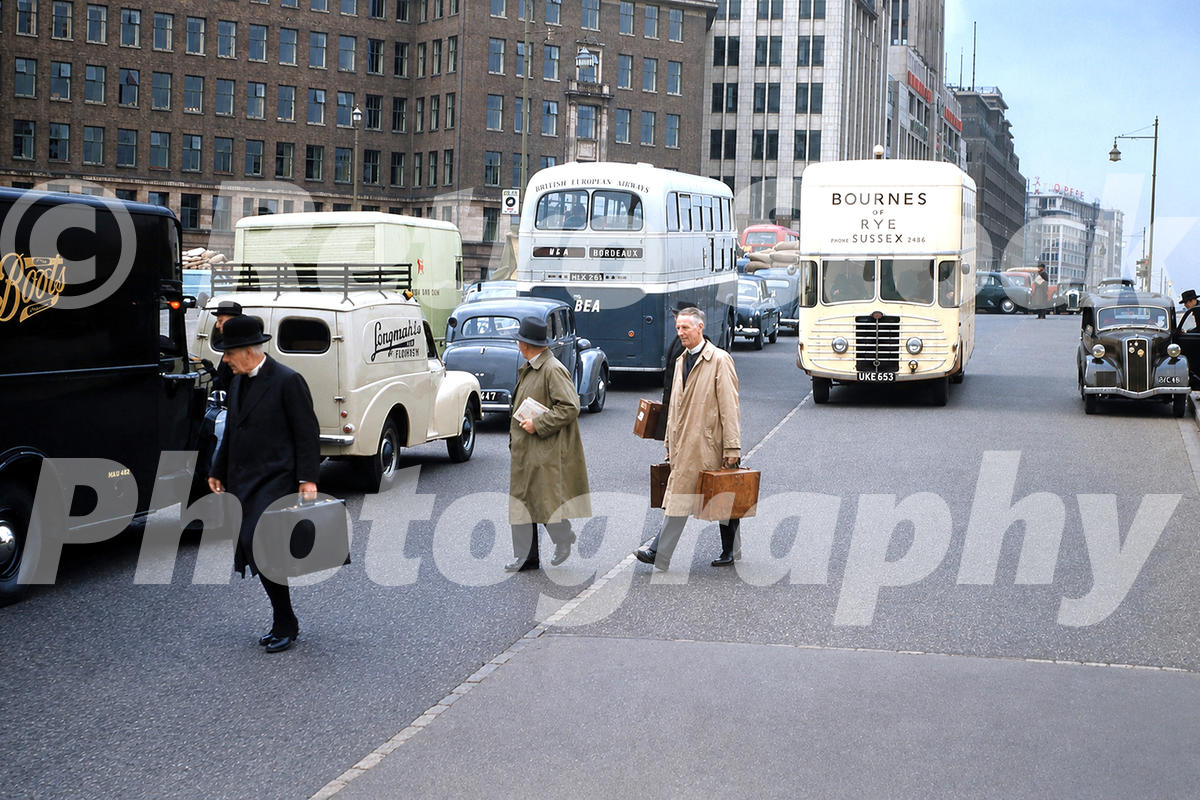 buckingham-palace-road-london-1950s_55260912134_o 1950s view of Buckingham Palace Road in London, with British European Airways and Bournes coaches, vans, cars and pedestrians crossing the street.