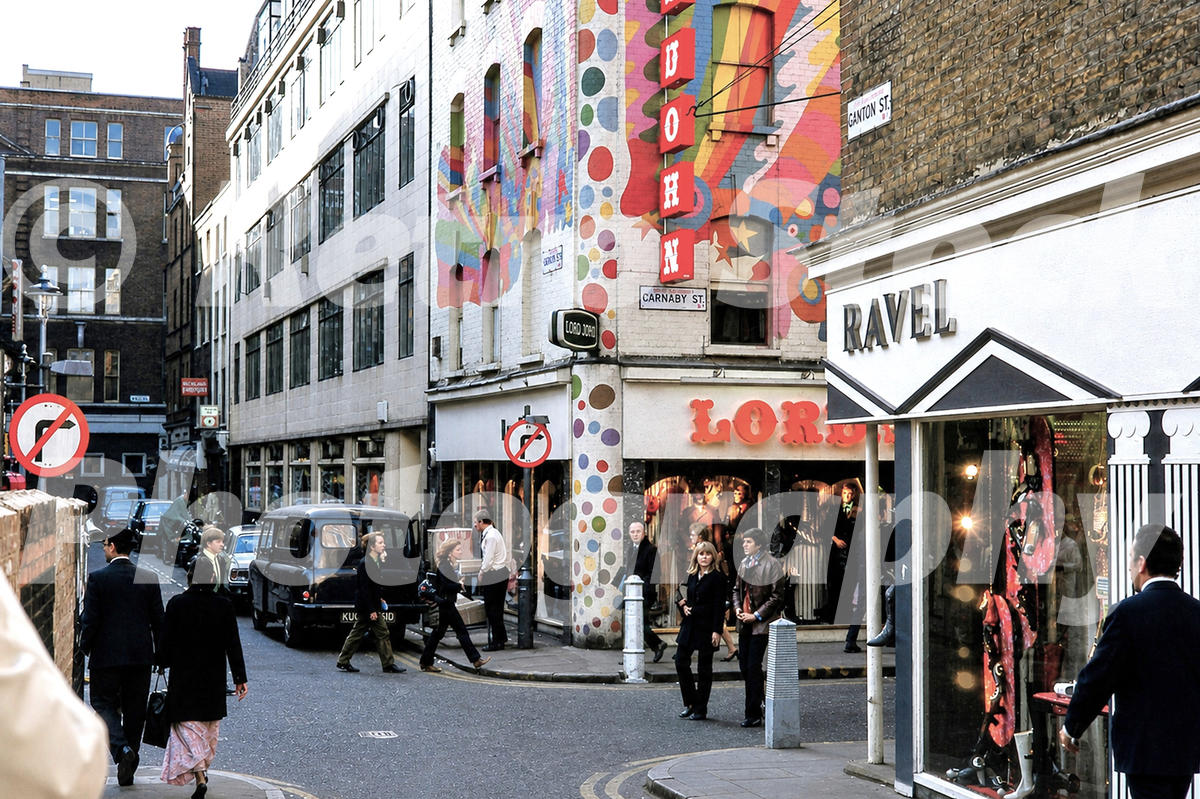 A 1960s colour photo of fashionable shoppers at the junction of Carnaby Street and Ganton Street in 1969.