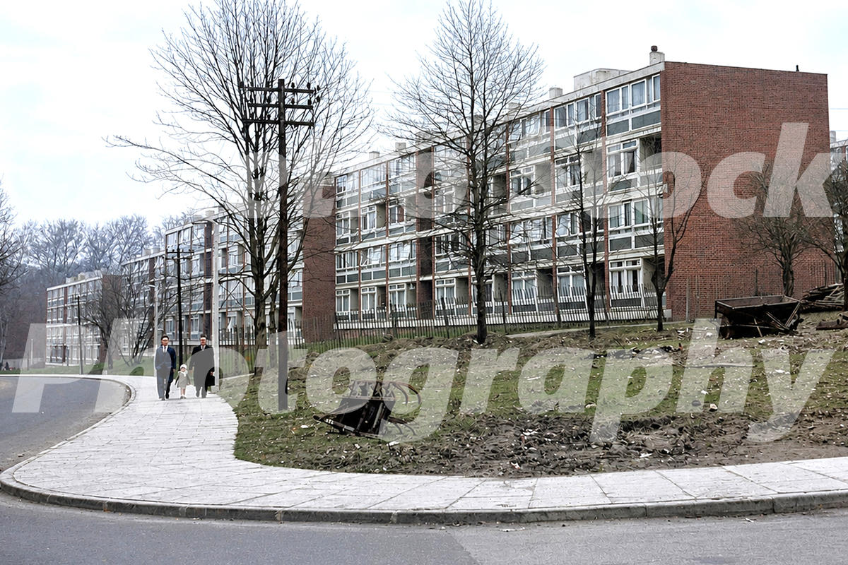 1960s view of Danebury Avenue on the Alton Estate in Roehampton, London, with post-war maisonette blocks, bare trees, unfinished ground and pedestrians.