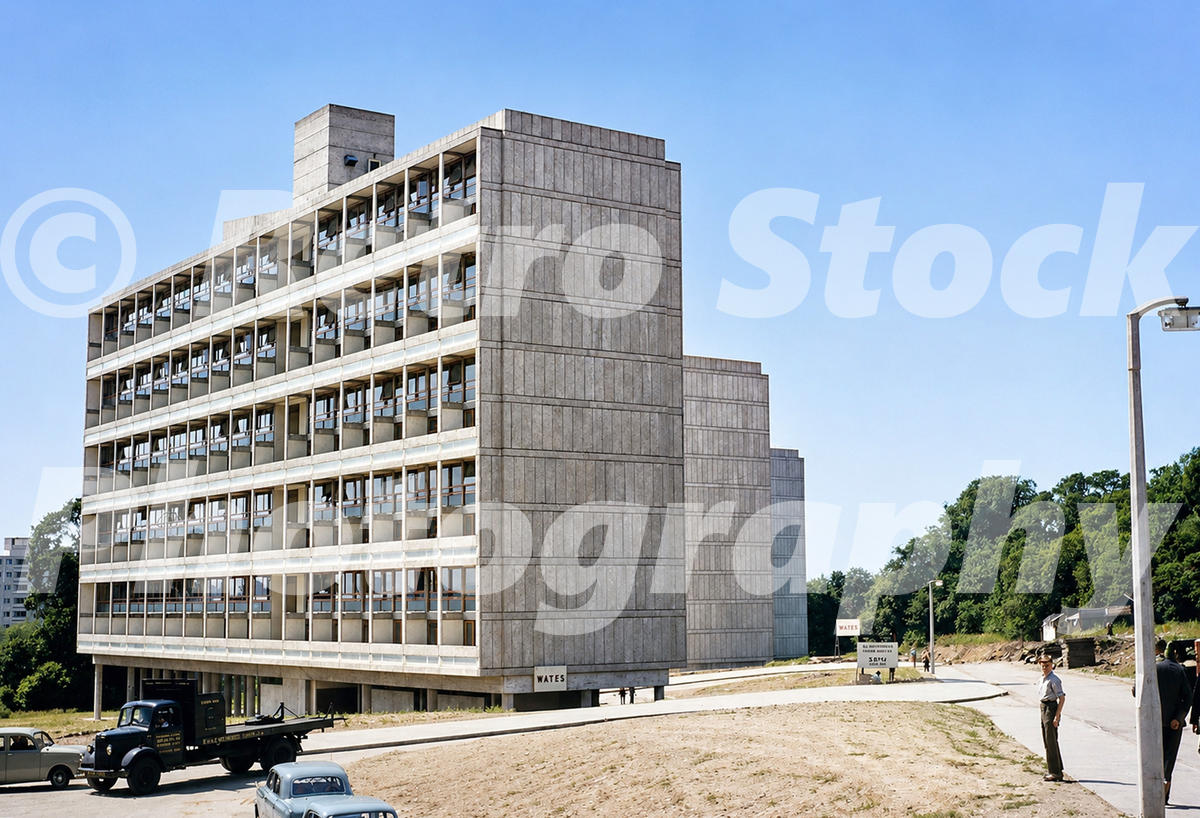 A 1950s colour photo of newly constructed high-rise concrete apartment blocks at Highcliffe Drive on the Alton Estate, featuring modernist geometric facades and a black vintage lorry parked on a dirt track.