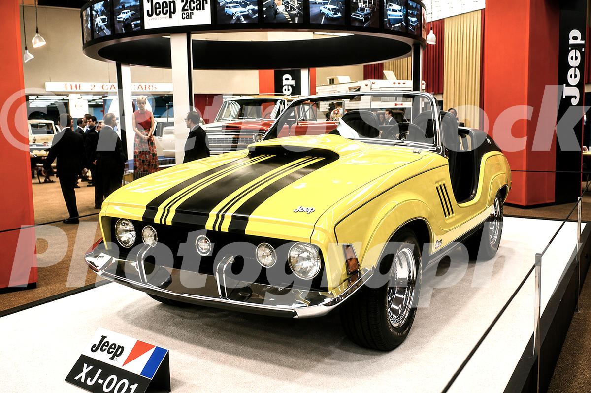 A 1970s color photo of the yellow and black Jeep XJ-001 concept car on a display stand at the 1970 New York Auto Show.