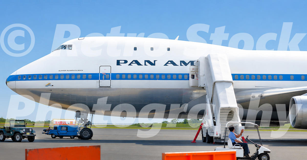 1970s colour view of Pan Am Boeing 747 Clipper Plymouth Rock in Australia, with mobile stairs, Shell ground equipment and airport vehicles.