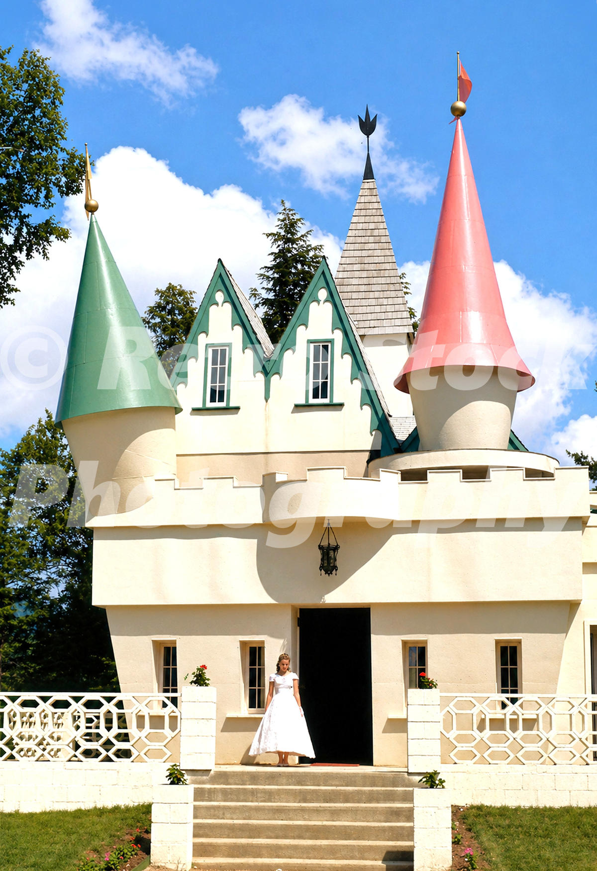 1950s color view of a princess standing at the entrance to the fairy-tale castle at Story Land in Glen, New Hampshire.