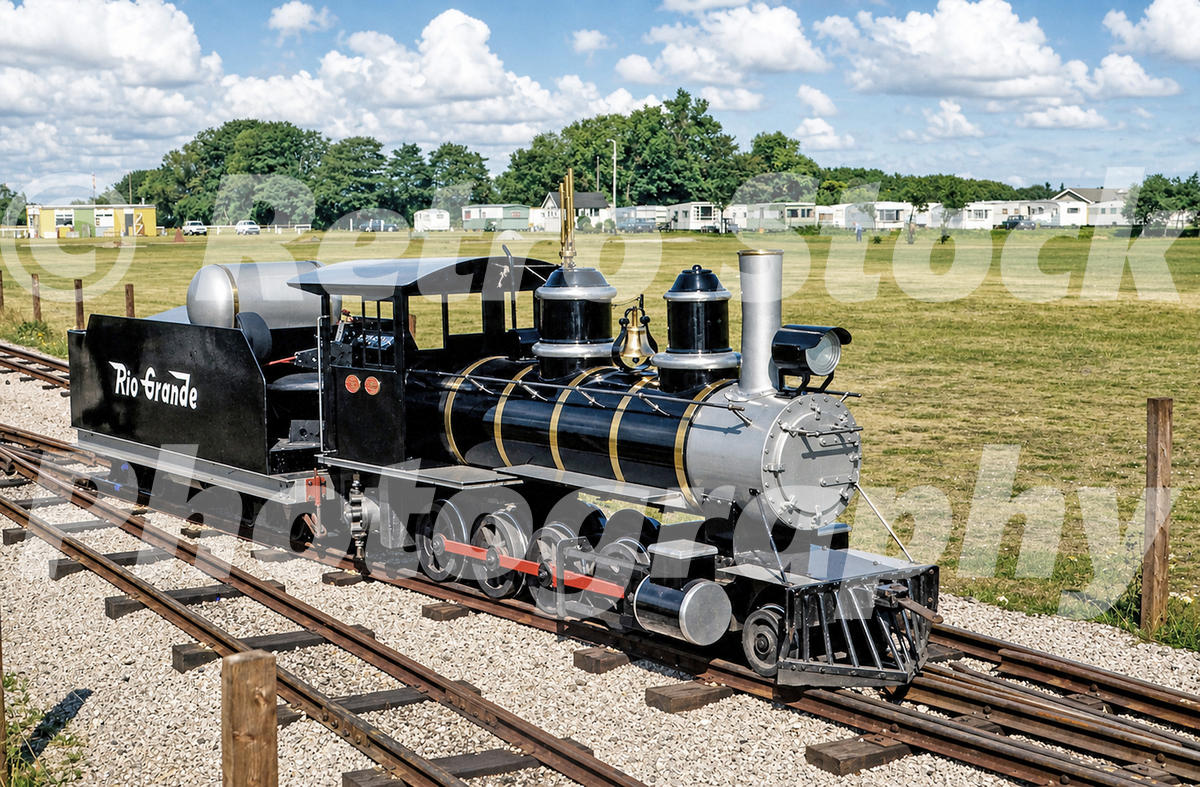 1970s view of Severn Lamb Rio Grande locomotive at Cleethorpes Miniature Railway, styled like a steam engine with a propane tank on the tender.