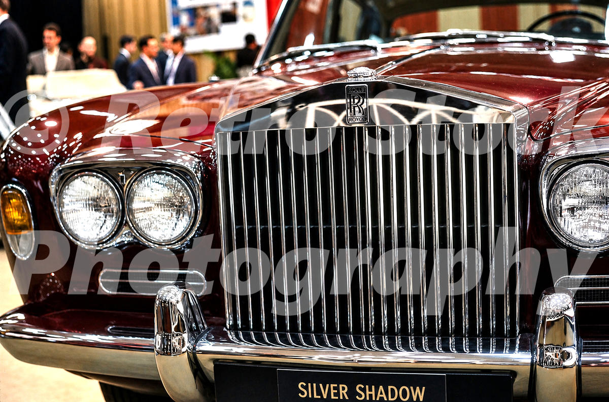 A 1960s colour photo of the front grille and Spirit of Ecstasy mascot of a maroon Rolls-Royce Silver Shadow at the 1968 New York Auto Show.